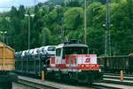 On 29 May 2004, electric shunter 1163 010 brings in a train of automotives at Schwarzach-St.Veit.