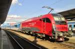 Advertiser 1216 229 leaves Brno hl.n. with as Prague-bound Railjet on 2 June 2015.