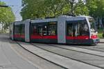 Tram 97 of Wiener Linien is entering the turning loop at the Westbahnhof Wien stop.