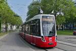 Tram 332 of Wiener Linien, operating on line 6, arrives at the Westbahnhof stop in Vienna.