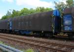 Wagon on bogies with four sets of wheels and sliding tarpaulin for coil transport (Shimmns), of the Express-Interfracht (Austria) on 17.05.2011 in Herdorf (Germany.