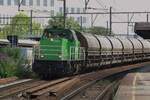 Railtraxx 6481 hauls a zinc ore train through Antwerpen-Berchem on 14 July 2022.