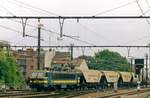 Under less-than-ideal weather NMBS 12 hauls a cereals train through gent Sint-Pieters on 4 Augustus 1998.