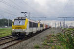 On a grey 18 June 2014 NMBS 1322 hauls a container train through Antwerpen-Luchtbal.