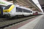 SNCB 1311 hauls a steel train through Charleroi Sud on 16 September 2021.