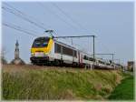 HLE 1337 is hauling the IC A Eupen - Oostende through Hansbeke on April 10th, 2009 