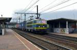On a grey 30 May 2013 NMBS 2018 hauls an intermodal service through Antwerpen-Noorderdokken.