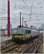 HLE 2130 is pushing its train out of the station Bruxelles Midi on June 22nd, 2012.