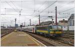 . HLE 2137 is pushing its train out of the station Bruxelles Midi on May 10th, 2013.