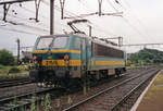 NMBS 2150 runs the rainy gauntlet at Merelbeke on 6 August 1997.
