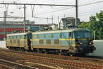 NMBS 2303 hauls a sister through Antwerpen-Berchem on 13 June 2006.