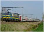 HLE 2760 is heading the double train to Blankenberge and Knokke in Hansbeke on April 10th, 2009.