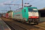 TRAXX advertiser 2825 hauls a mixed freight through Antwerpen-Noorderdokken on 23 May 2013.