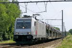 The HSL E 186 028 with a car train.