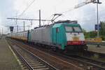 NMBS 2803 banks an IC-Brussel out of Antwerpen-berchem on a grey 5 May 2023.
