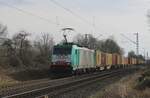Medway 186 219 hauls a container train to Antwerpen through Kaarst on 21 February 2025.