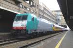 CoBRa 2803 with Benelux to Amsterdam hides in the shadow off tall buildings at Bruxelles-Midi on 12 September 2009.
