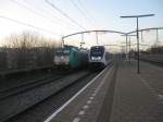 NMBS 2813/186-205 storms through Zwijndrecht with an Express for Brussels while a SLT 6-car set leaves as local train for Breda, 02/01/2015. 