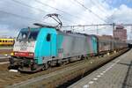 The Sun breaks through at Amersfoort on 17 October 2014 to lighten up 2820 with the Volvo container train to Antwerpen.