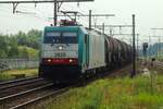 A bit against the Sun light and with zoming from the platform: CoBRa 2829 hauls a tank train through Antwerpen-Noorderdokken on 29 August 2013.