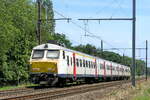 The NMBS 842 on route from Antwerpen-Berchem station to Lier station. BN Brugge MS75 build in 1979, modernized in 2019. NMBS Class MS75 (MR75/EMU75) : Between 1975 and 1977 44 of these EMU (Electric Multi Unit) were build by BN Brugge. Numbers 801 to 844. Number of Carriages: 4. Length: 99,03m. Number os seats: 368. Max speed: 140km/h. Power supply: 3000V and 1500V (NL). Modernized between 2015 and 2020. Nickname: Pig Nose. Line 27A at Antwerp Airport. 22-06-2026