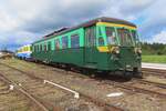 Railbus 554.10 stands at Mariembourg with the CFV3V on a sunny 23 September 2023.