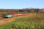 Locomotive 2905/186 350 from Lineas hauling a container train from Aachen to Zeebrugge is passing in Wonck, 1/2/2025.