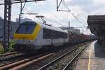On 1 July 2026 Lineas 1319 hauls a container train through Antwerpen-Berchem.