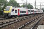 Desiro 08017 leaves Antwerpen-Berchem for Antwerp Central Station on 22 Augustus 2013.