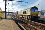 Bit against the Sunlight: PB14 hauls a train with automotives through Antwerpen-Noorderdokken on 19 November 2016.