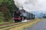 In the pouring rain, freshly restored 64 250 hauls a steam shuttle out of Treignes toward Marienbourg via Olloy during the 50th anniversary of the CFV3V.