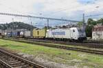 Metrans 386 008 hauls an intermodal train out of Bratislava hl.st.