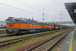 On 23 September 2017 AWT 753 705 hauls a coal train into Ostrava hl.n. under a light shower.