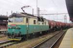 GATX-tank train with CD 130 006 speeds through Kolin on 26 May 2015.