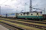 On a grey and rainy 4 June 2013, an Ewals intermodal service stands at Pardubice with 130 010 at the reins.