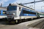 The loco driver of 242 250 chats with a collegue at Plzen hl.n.