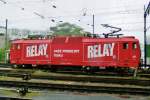 Scanned picture of CD 363 033 with RELAY-advertisenemnt, leaving Brno hl.n. on a soaking 22 May 2008.