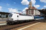 Plain white mercenary 6 193 684 stands on 12 June 2022 at Praha hl.n. with the new InterJet train.
