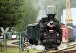 On 10 June 2022, ex-CSD 354.195 pushes an extra train back into the railway museum of Luzna u Rakovnika.