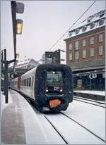The DSB IC3  Rubber nose  2120 is ready for departure in Copenhagen during heavy snowfall.

Analog image from March 20, 2001