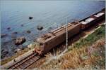 An old photo from my archive: Shortly after Taormina, an FS E 636 with a freight train travels along the sea. The train is on its way towards Messina.

Analogue photo from May 1988