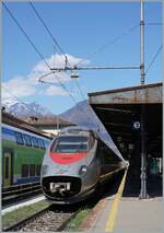 FS Trenitalia ETR 610 003 patiently waits in Domodossola as EC 142 Domodossola - Geneva for departure. The train arrived in Domodossola at 10:12 as EC 143 and was then parked for the return journey. This was due to the lengthy construction work betwe ...