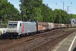 Akiem/Lineas 186 384 hauls a freight through Köln Süd on 7 June 2019. 