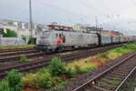 Akiem 37020 hauls a steel train through Köln West ion 19 May 2022.