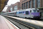 Wearing the En Voyages... scheme, SNCF 67610 calls on 2 June 2014 at Lyon Part-Dieu with a CoRail service.