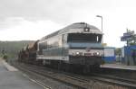 CC 72084 with freight train passes through Longueville on the evening of a rainy 18 September 2011.