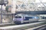 CC 72049 -the only CC 72000 in the En Voyages-colours without being refurbished, refurbished locos being renumbered in the 72100-series- at Paris Est on 19 September 2011, shot from behind the window of 'my' RER. 