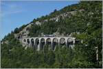 The SNCF X 73657 on the way from Dole to St-Claude on the 165 meter long Viaduc des Crottes near Morbier. 

10.08.2021