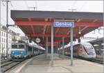 In Geneva, the SNCF BB 22360 with its TER to Valence and the Lyria TGV to Paris Gare de Lyon are waiting for departure.