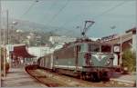 SNCF BB 25635 with a local train by  the stop in Menton.
scanned negative/September 1987